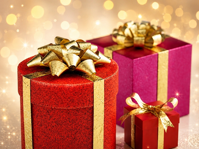 festive gift boxes with golden ribbons